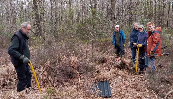 A group of Sevenoaks Greensand Commons volunteers outside with tree poppers.