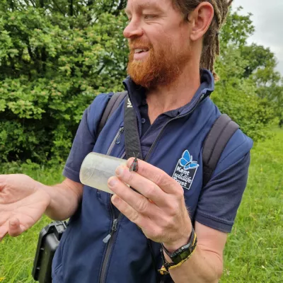 Matt Orwin with a 6-spot burnet moth