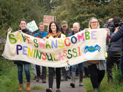 Swansombe Rally October 21 where campaigners hold banner saying "Save Swanscombe Peninsula SSSI"