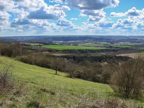 burham down view from the sloping chalk grassland down into the countryside landscape below