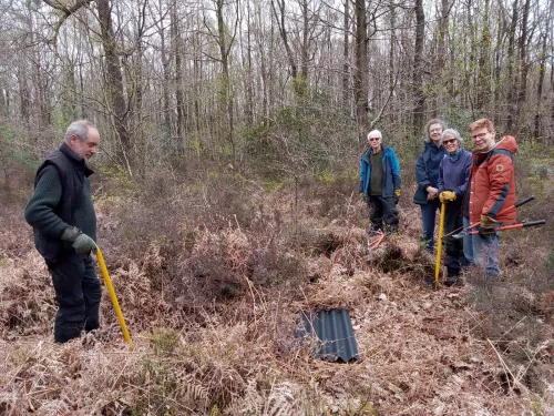 A group of Sevenoaks Greensand Commons volunteers outside with tree poppers.